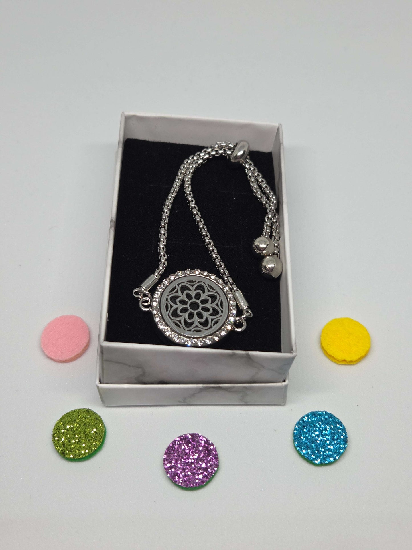 Silver coloured perfume diffuser bracelet with flower head design - MAZAROMA