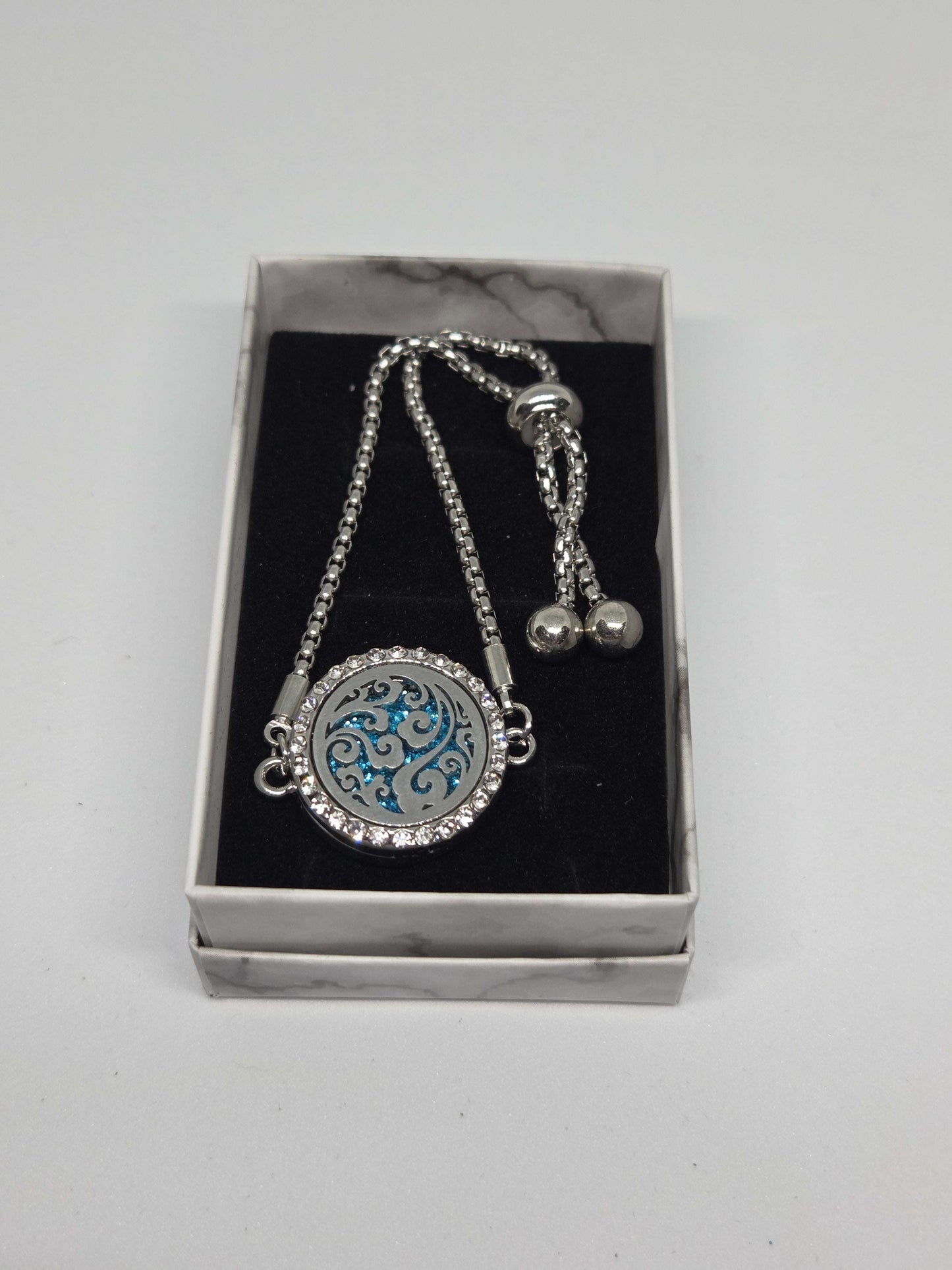 Silver coloured perfume diffuser bracelet swirls design - MAZAROMA