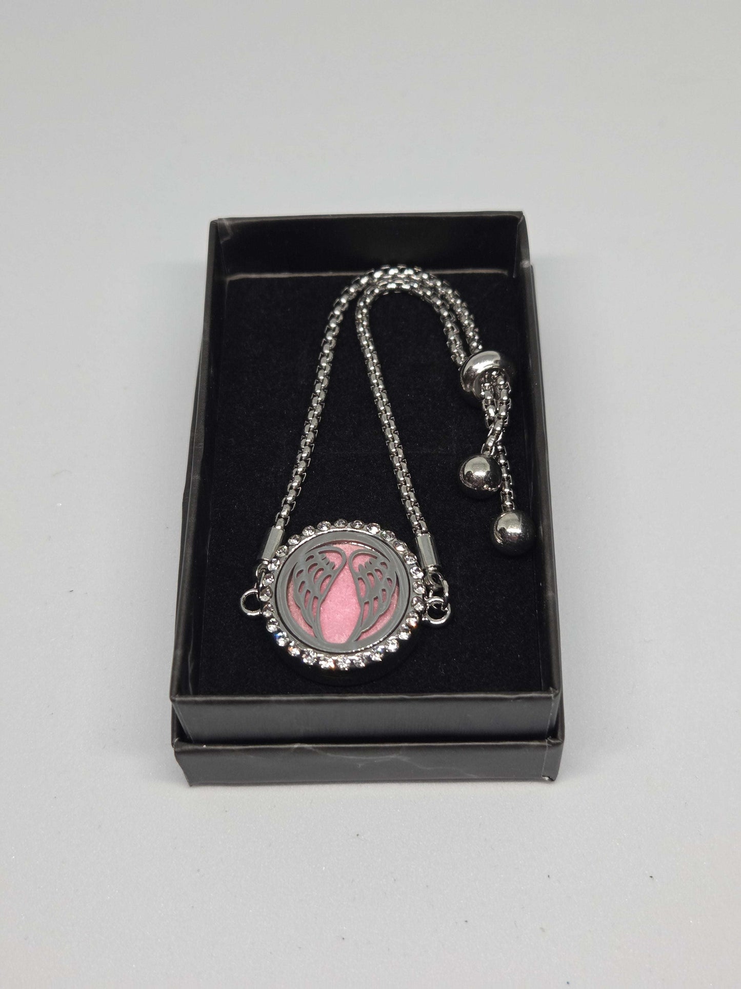 Silver coloured perfume diffuser bracelet angel wings design - MAZAROMA