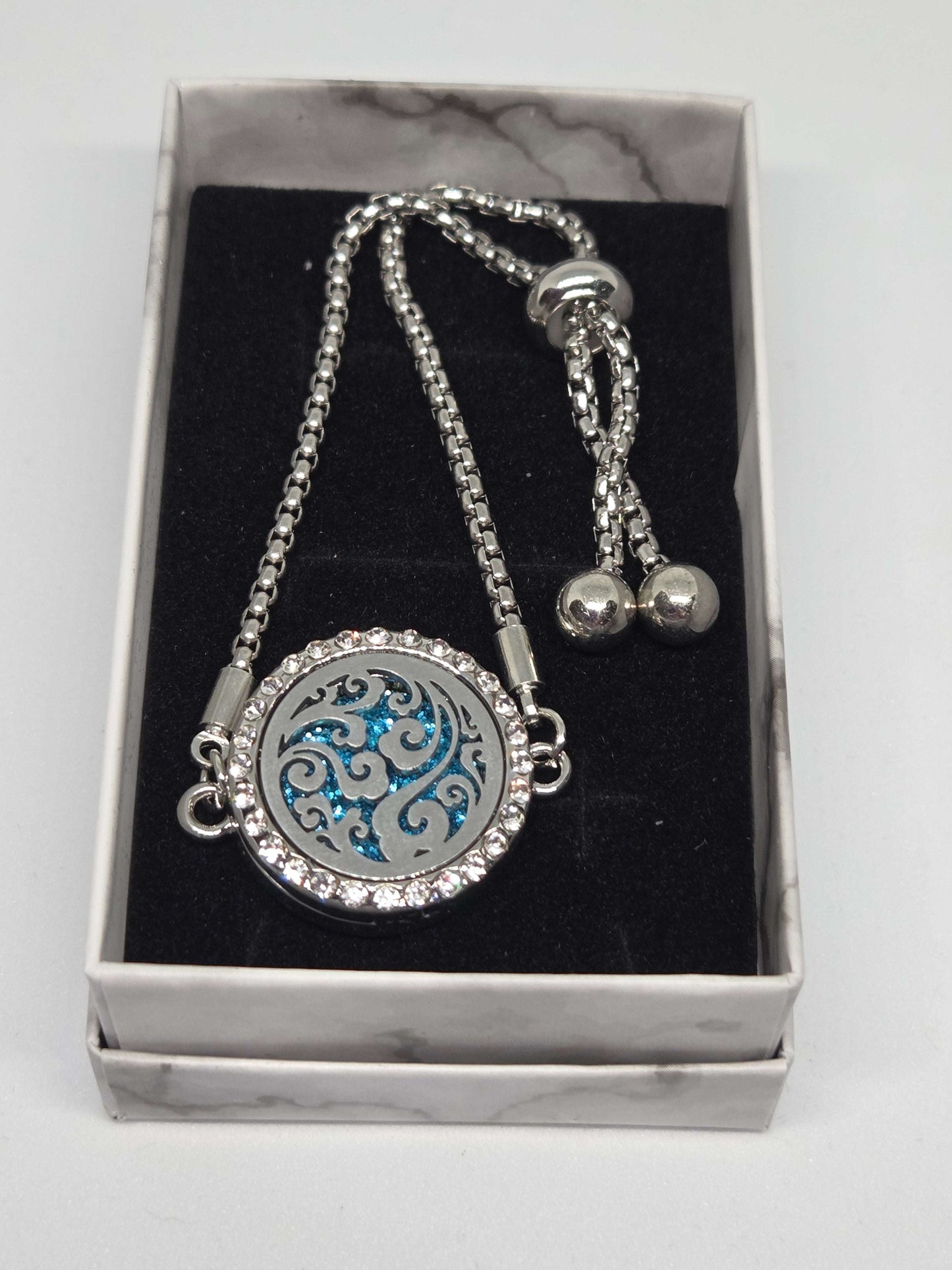 Silver coloured perfume diffuser bracelet swirls design - MAZAROMA