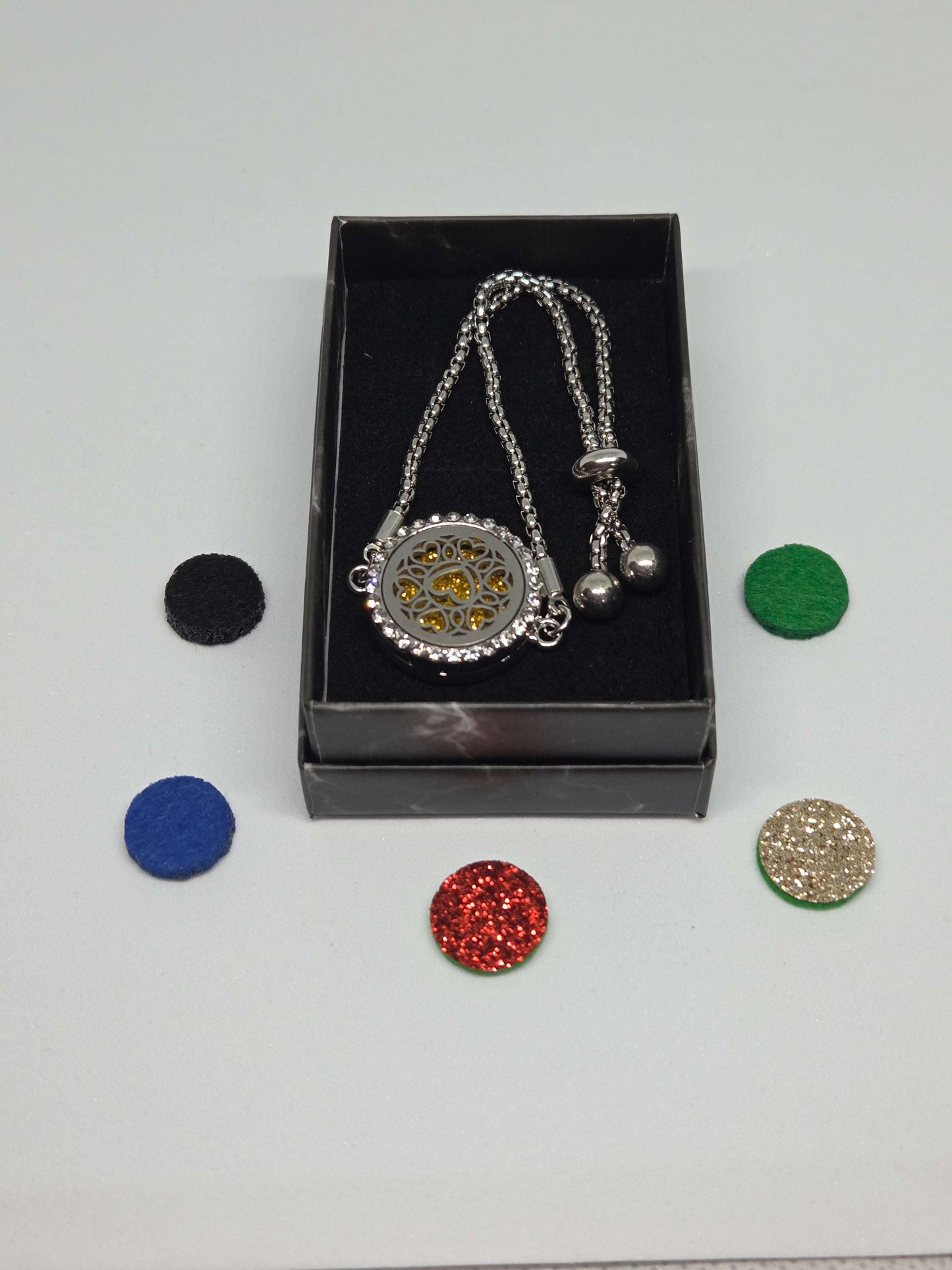 Silver coloured perfume diffuser bracelet with diamanté face in love hearts design - MAZAROMA