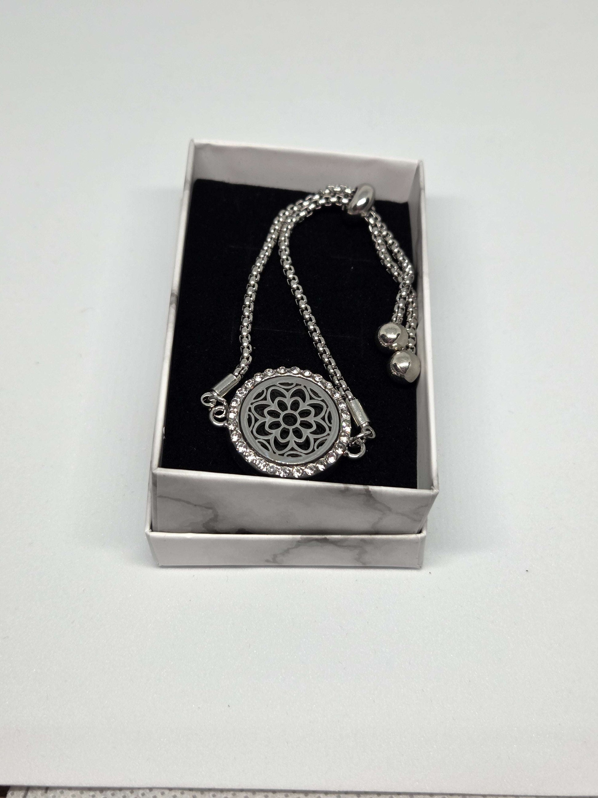 Silver coloured perfume diffuser bracelet with flower head design - MAZAROMA