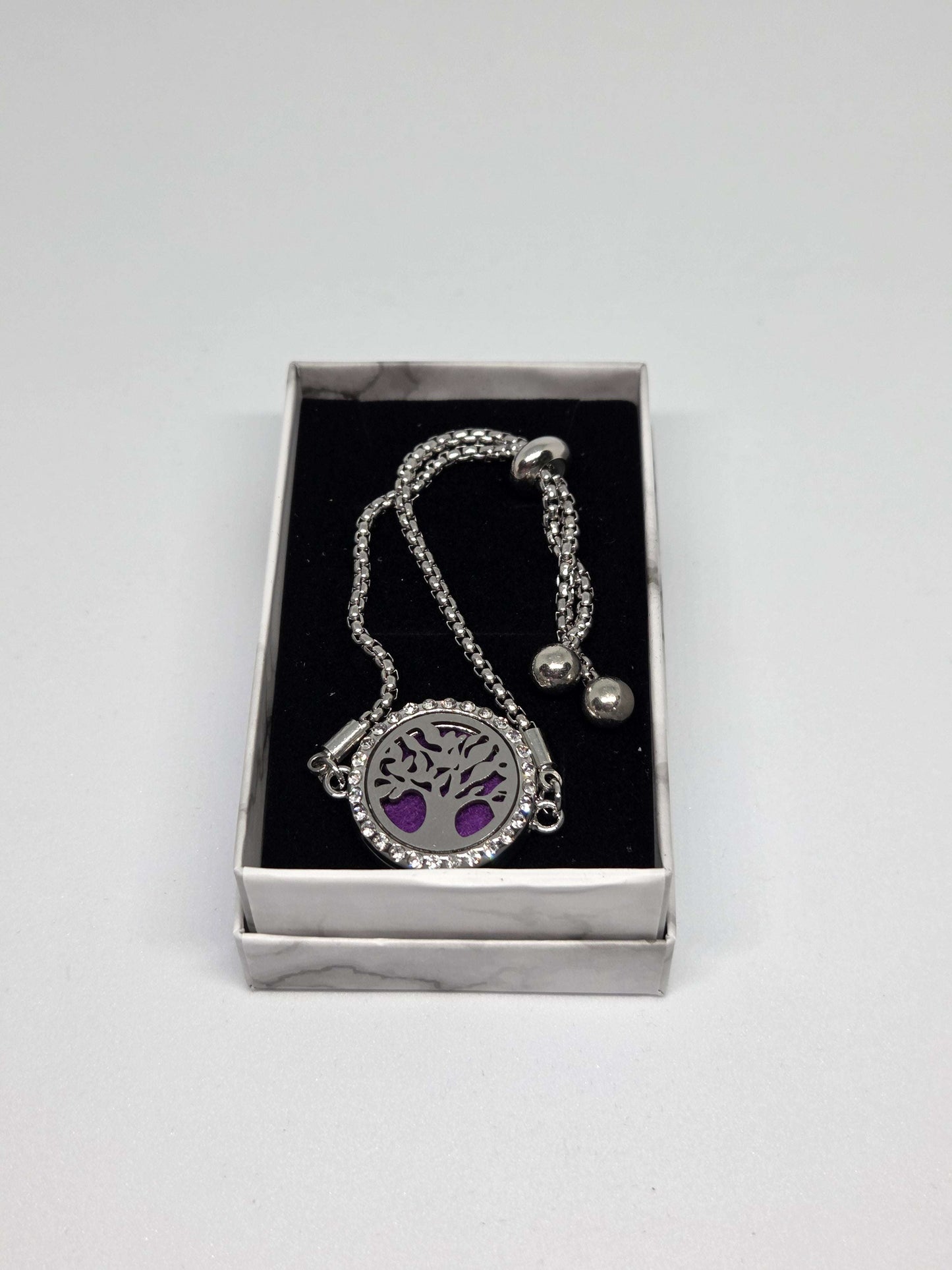 Silver coloured perfume diffuser bracelet in a tree design - MAZAROMA