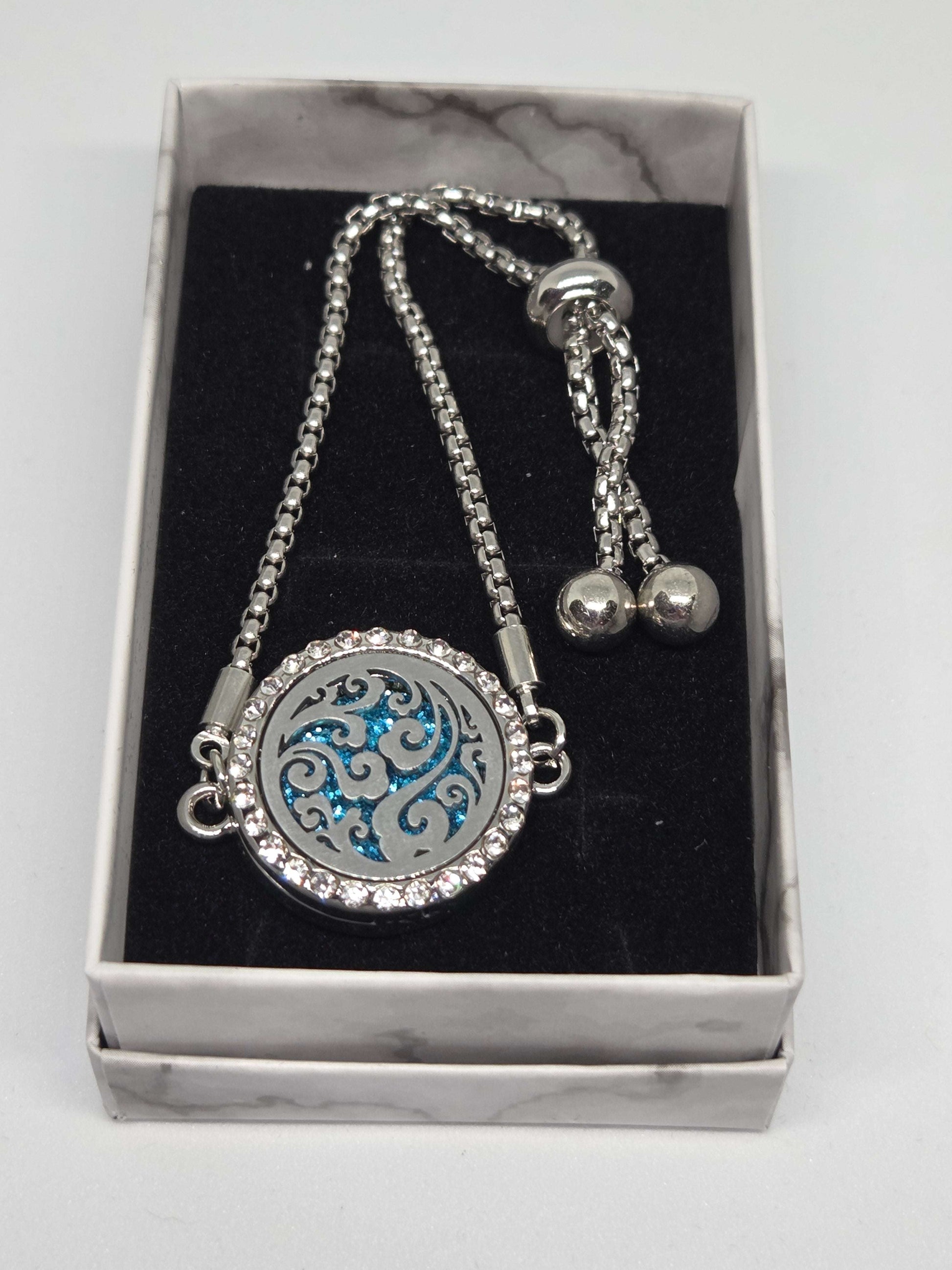 Silver coloured perfume diffuser bracelet swirls design - MAZAROMA