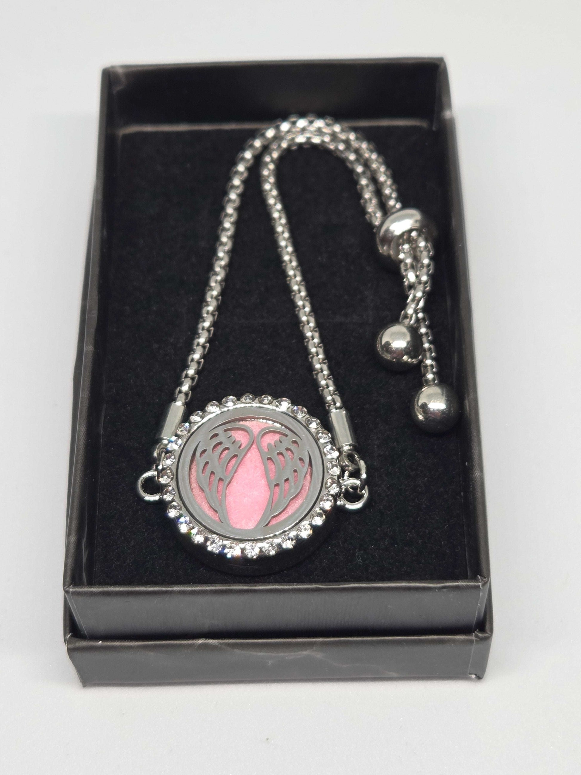 Silver coloured perfume diffuser bracelet angel wings design - MAZAROMA