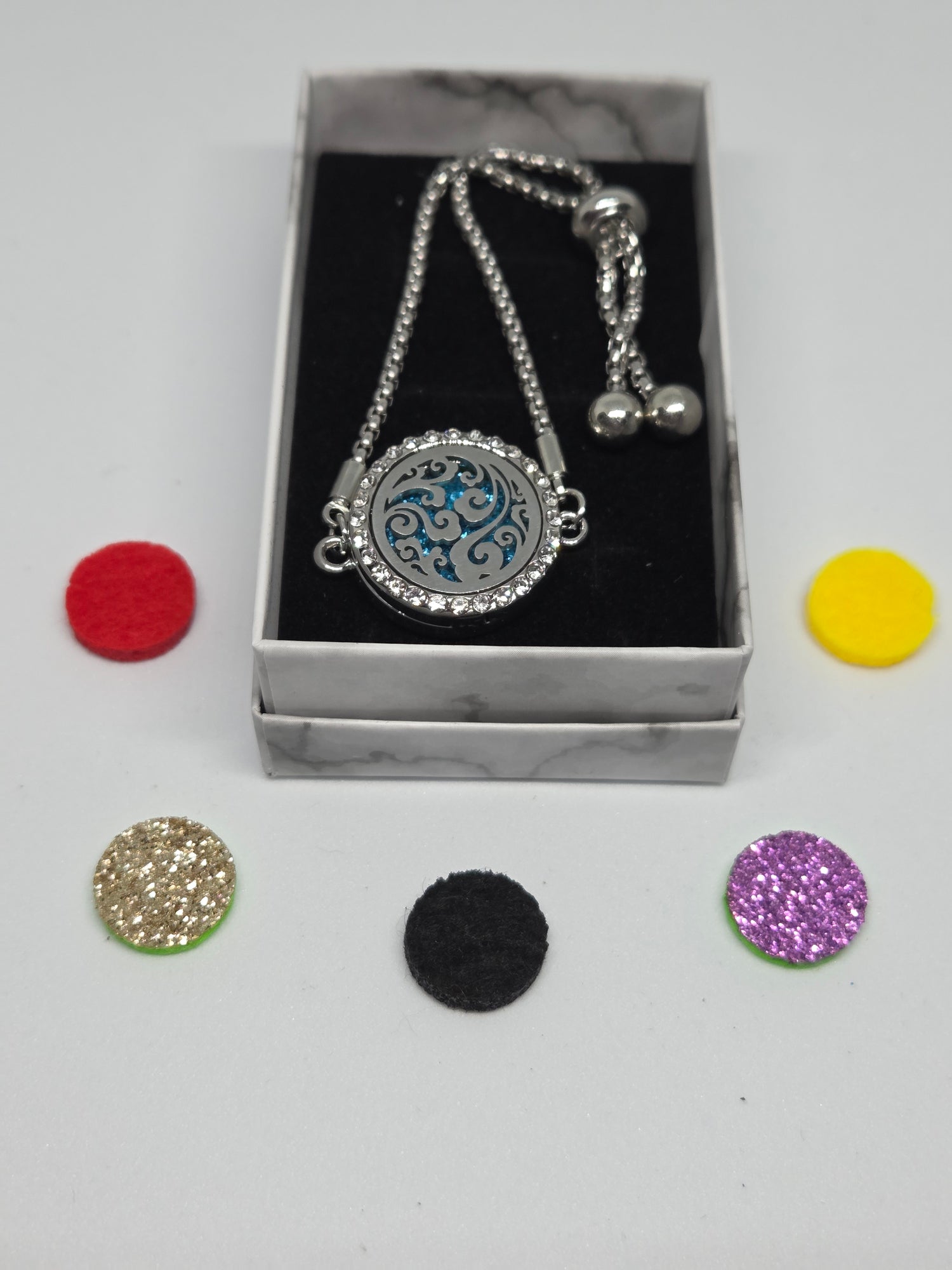 Silver coloured perfume diffuser bracelet swirls design - MAZAROMA